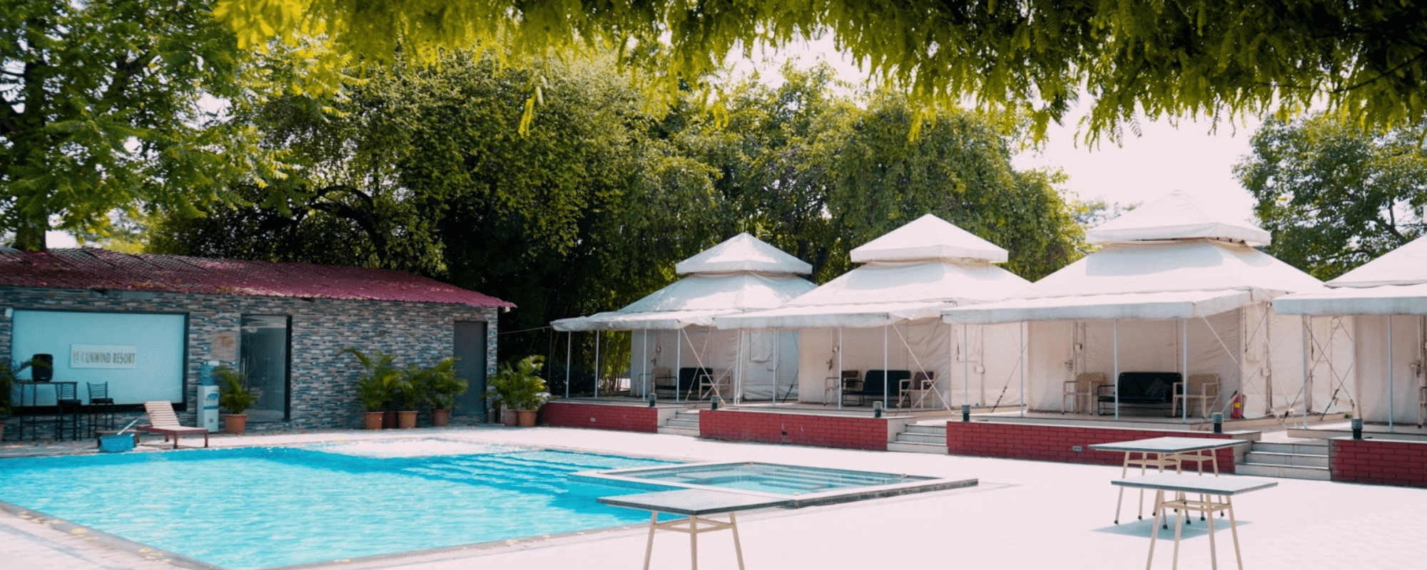 Poolside garden seating at Unwind Resort